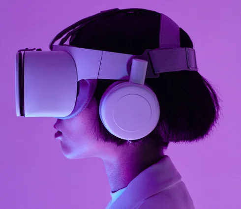 Young woman in virtual reality glasses