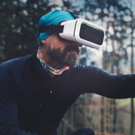 Man wearing virtual reality glasses in nature